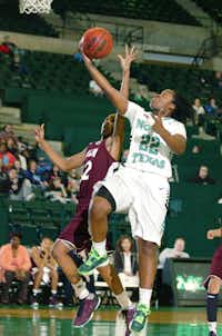 North Texas guard BreAnna Dawkins, right, moves in to score against Louisiana-Monroe guard Alexar Tugler last Saturday at the Super Pit. Today, UNT will play host to South Alabama.DRC/David Minton