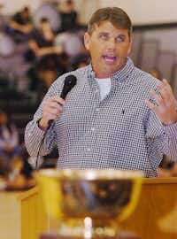 With the state championship trophy in front of him, Guyer head coach John Walsh told the crowd assembled how few teams have won back-to-back state championships, during the community pep rally Friday morning.Al Key - DRC