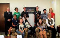 DATCU recently introduced its Junior Board of Directors. Standing, from left, are DATCU President and CEO Dale Kimble, Morgan Carter, Max Atkinson, Javan Stalls, Virin Tamprateep and DATCU Senior Vice President and Chief Financial Officer Melanie Vest. Seated, from left, are Haylee Smith, Emily Staniszewski, Dionne Agawu, Jasmine Kennard, Kylie Richter and Pat Sherman, DATCU vice president of business development.Courtesy photo