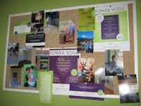 A bulletin board at Authentic Yoga Life displays photos of some of the studio’s students, notices about class offerings and more.Karina Ramírez - DRC