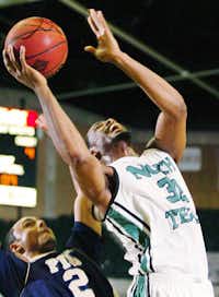 North Texas guard Roger Franklin, right, looks to score against Florida International guard Marco Porcher-Jimenez on Saturday at the Super Pit.DRC - David Minton