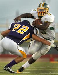 Sanger linebacker Brice Escobedo, left, tackles Dallas Madison running back Corey Wright on Aug. 31 in Sanger.For the DRC/Steve Hamm