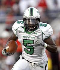 Former North Texas running back Lance Dunbar carries the ball during his time with the Mean Green.DRC file photo