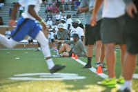 Coaches time prospects for their 40 yard time as hundreds of players turn out for North Texas' Friday Night Lights football camp at Apogee Stadium in 2014.DRC file photo