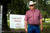 Tommy Calvert, 66, stands beside his family's ranch sign. Calvert Ranch has been passed down through generations of Calverts, starting after Tommy's grandfather bought the original 140 acres in 1946. Calvert also serves as president of the Denton County Farm Bureau.For the DRC
