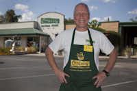 Paul Tanis, Cupboard general manager, poses in front of Cupboard Natural Foods.DRC file photo