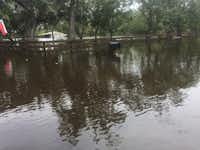 A city of Denton crew confronted flooded waters near the city of Brazoria's wastewater treatment plant. Crew members had to approach the plant by boat in order to make repairs.City of Denton
