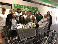 Members of both the Lake Dallas High School Student Council and football team donate toys and bike to the Lake Cities Spirit of Christmas organization. Pictured are, front row, from left, Blake Tatum, Gabby Thomas, Morgan Sams, Abbey Harrison and Spirit of Christmas Coordinator Sugene May; back row, from left, Cooper Erwin, Mason Turner, Hayden Brockenbush, David Blair, Ryan Hawley, Sydney Nunley, coach Mike Young and student council adviser Katie Burke.Lake Dallas ISD
