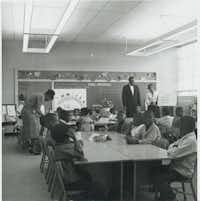 Alice Alexander (far right holding white sign) teaches her first-grade class at Fred Moore School. The Denton ISD school board recently decided to rename Robert E. Lee Elementary School after Alexander for the upcoming school year.Kim Cupit