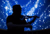 Ed Hillers practices for his light showWednesday, April 5, 2017, at Sky Theatre in Denton, Texas. . Hillers saw the Denton debut of his laser music show, 'Liquid Floyd' las month at the UNT Sky Theatre. The show - an hour-long concert of music by iconic English rock band Pink Floyd - uses video graphics, animation and laser light beams projected onto the dome ceiling of the UNT planetarium. He also performs a song or two on his electric violin, with animations and lights moving in time with his performance. He presents the show on the third Friday of the month. Reservations are recommended as shows sell out quickly. Tickets cost $20 to $30. Tomas Gonzalez/DRC ORG XMIT: txderDRC