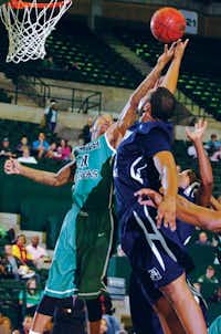 North Texas senior forward Justin Patton, left, reaches for a rebound against Jackson State guard Kelsey Howard on Dec. 8 at the Super Pit.DRC file photo