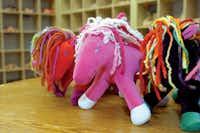 Dragonfly’s Hollow also makes stuffed critters, like these brightly colored ponies.Al Key/DRC
