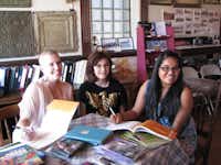 2010 Texas Poet Laureate Karla K. Morton, left, author of "Hometown Texas: Young Poets and Artists Celebrate Their Roots," appears with students Cristina Romo, center, and Mikayla Vilicich during a receptionin May at the Krum Heritage Museum. The students' work is part of their anthology.Courtesy photo