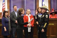 16th District Court Judge Sherry Shipman swears in Jerry Raburn as constable for Denton County’s Precinct 3 on Sunday at the Courthouse on the Square. Raburn, who has served as constable since 1993, said he plans for this term to be his last.Tomas Gonzalez - DRC