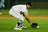 Guyer senior Connor Garcia (14) scoops up a bunted ball against Keller, Tuesday, April 17, 2012, in Denton, Texas.David Minton