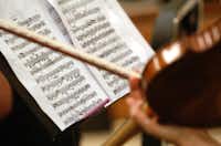 Sheet music is shown in detail Tuesday as members of the Odysseus Chamber Orchestra practice.David Minton