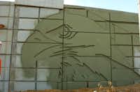 The ramps for the bridge on both sides of I-35E feature large eagle heads.David Minton