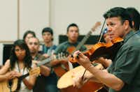 Jose Hernandez of Mariachi Sol de Mexico, instructs the class of middle and high school students on the ins and outs of Mariachi at the UNT Mariachi Aquilltas Summer Camp, Wednesday, July 25, 2012, in Denton, TX.David Minton
