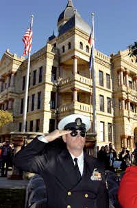 Retired US Navy chief petty officer Donald Phillips salutes during the pledge of allegiance at the Veterans Day program at the Courthouse-on-the-Square Monday November 12, 2012, in Denton.Al Key - DRC