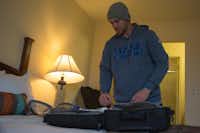 Dane Evans packs for a Super Bowl weekend trip to Houston, on Thursday in Fort Worth.Photos by Jeff Woo