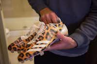 Sanger product Dane Evans shows the cleats he wears for sprint drills.Jeff Woo
