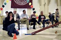 Judges laugh as a team’s entry falls off the racetrack during TWU’s Edible Car Contest on Friday.Tomas Gonzalez