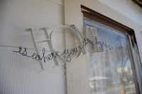 A decorative piece that reads “Home is where your story begins” greets guests outside the Cadena home. The Cadenas came to Denton in 2000 to visit family and decided to stay.Caitlyn Jones