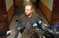 Reporters talk to Chris Mundy, brother of Kathy Stobaugh, outside the 362nd District Court in the Denton County Courts Building after the hearing for his brother-in-law, who was released Thursday.Al Key - DRC