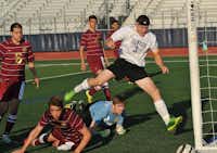 Denton's Michael Husbands (3) barely misses a goal in their playoff game against Saginaw in Flower Mound Tuesday March 25, 2014.Ray Watson - For the DRC
