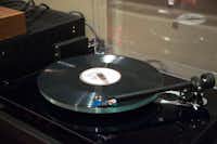 A record spins on a record player at Hand Drawn Pressing.Jeff Woo