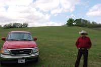 Jack Parkes stands at the bottom of the hill behind his home where the City of Denton plans to re-route South Bonnie Brae St. The road is to be re-routed and widened to travel down the hill behind their home. Negotiations with the city for their land have not gone well and they are one of four landowners where eminent domain proceedings have already begun, Thursday, March 28, 2013, in Denton, TX.David Minton - DRC