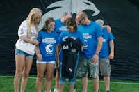 The family of Guyer High School senior Nathan Maki receives his #33 jersey during a pre-game ceremony before kickoff against Colleyville-Heritage, Thursday, September 5, 2013, at C.H. Collins Athletic Complex in Denton, TX.David Minton - DRC