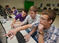 From right, Hunter Bennett, Tyler Sanders and Collin Jones work on a music video in their audio/video production class Thursday at Sanger High School. The trio’s animated short “GOAL!” made it to the state level of the UIL’s new filmmakers competition.Al Key