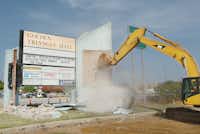 The sign at Golden Triangle Mall comes down after 33 years of service Friday morning August 2, 2013, in Denton.Al Key - DRC