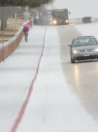 The hill on Bell Avenue near TWU was slick from the snow Thursday morning February 6, 2014, in Denton, Tx. Photo by Al Key/DRCAl Key