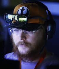 The World of Warships game is reflected in Alex Diehl’s sunglasses during at QuakeCon on Saturday in Dallas.Ron Baselice