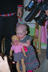 Two-year-old Brielle Perry embraces a new doll that was made to resemble her. Perry was born in September 2011, with Down syndrome and a heart defect. In April, she was diagnosed with leukemia and six rounds of chemotherapy followed, which she recently completed.John D. Harden