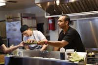 Andres Meraz, right, just opened Boca 31 at 207 S. Bell Ave. in Denton. Meraz, who worked as a chef at several high-profile restaurants around the world, is pictured Friday at his eatery.Photos by David Minton