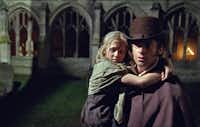 Jean Valjean (Hugh Jackman) becomes the guardian of young Cosette (Isabelle Allen) in Les Miserables.Universal Studios