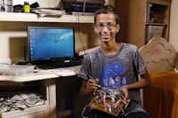 Ahmed Mohamed shows his new media player that he has been working on recently in his home in Irving on Wednesday.David Woo
