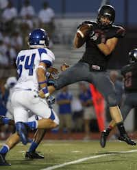 A pass is completed to Argyle's Connor Wilson (11) during a high school football game between Argyle and Fort Worth Nolan at Argyle's Eagle Stadium in Argyle, Friday, Sept. 6, 2013.Garett Fisbeck