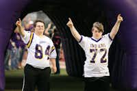 Blake Pyron and Austin Waters show their team spirit Friday at Indian Stadium in Sanger.Maegan Puetz