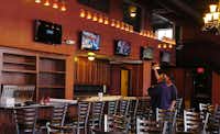 Five large television sets hang over at the bar at Cafe Herrera at 100 Oak St. in Denton.Al Key - DRC