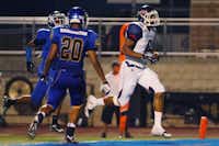 Ryan’s Tyrone Williams, right, crosses the goal line for a touchdown against Corsicana on Aug. 30 in Corsicana.David Minton
