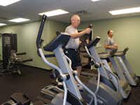 Texas Health Presbyterian Hospital Denton employees George Young, left, and David Layton use the hospital’s new fitness facility at the Center for Women.
